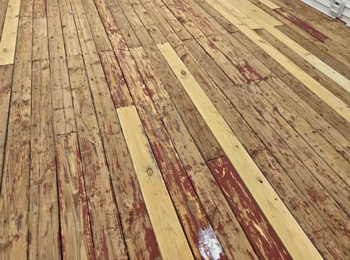 Weathered deck boards before restoration